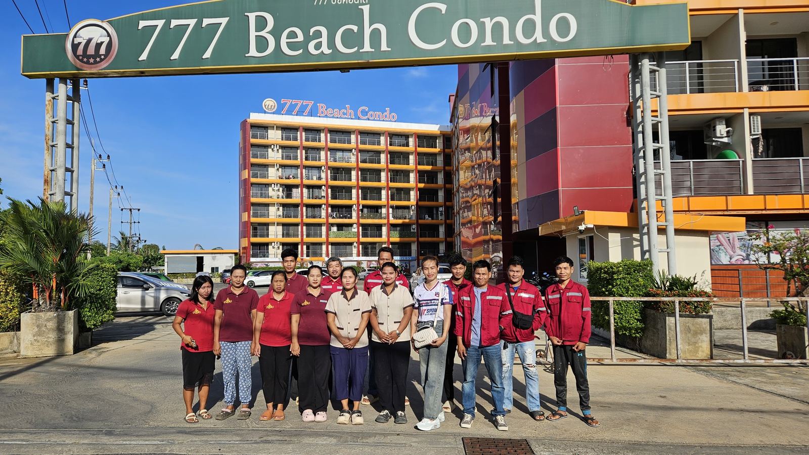 The 125 Rich Service team at the entrance of 777 Beach Condo